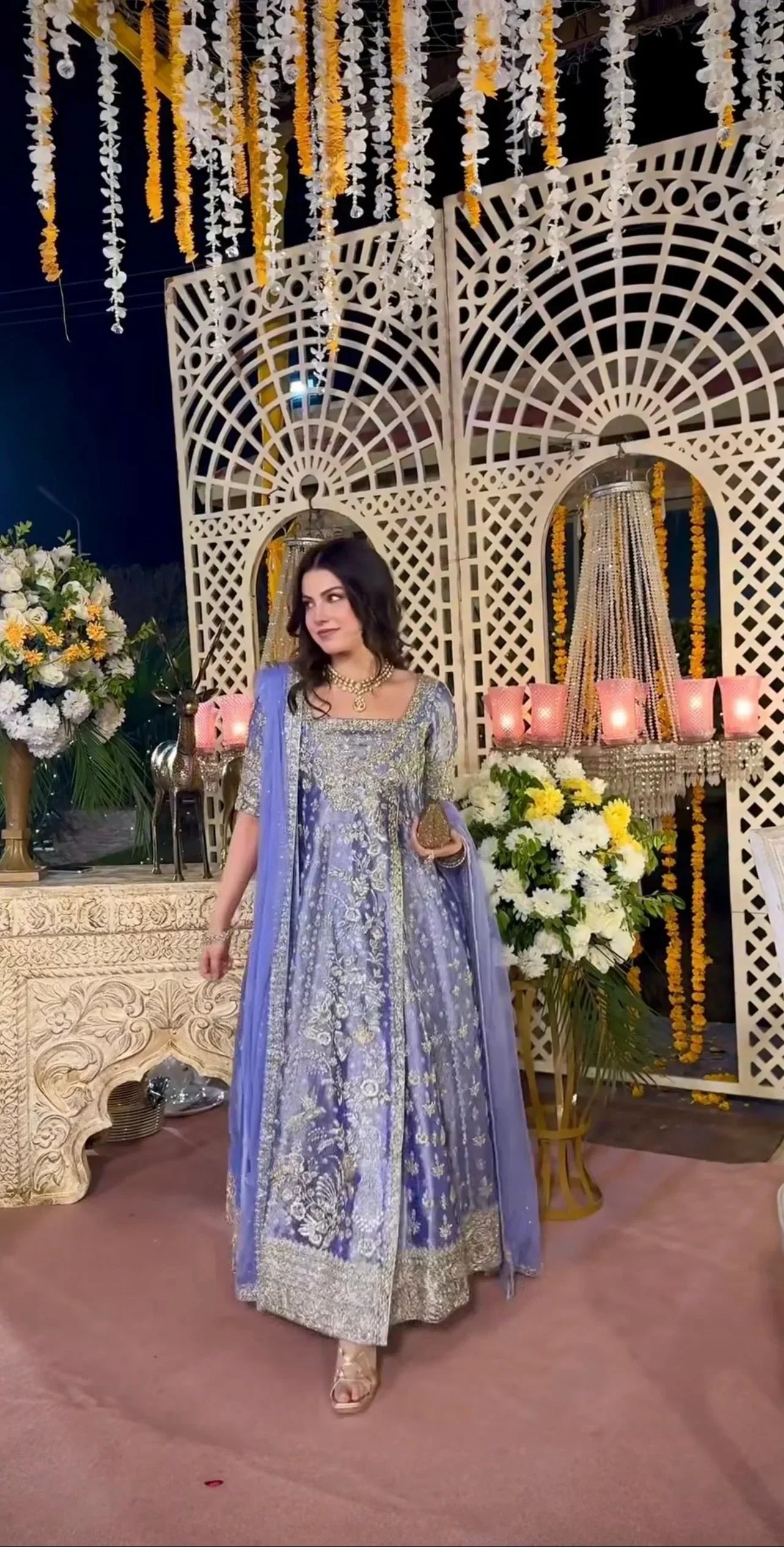 Haris Shakeel inspired Eyena ensemble in soft periwinkle-lilac featuring intricate silver zari, sequins, and resham embroidery delicately scattered across flowing panels with a richly embellished border, paired with a sheer net dupatta, perfect for festive occasions, mehndi functions, nikkah ceremonies, and formal gatherings.