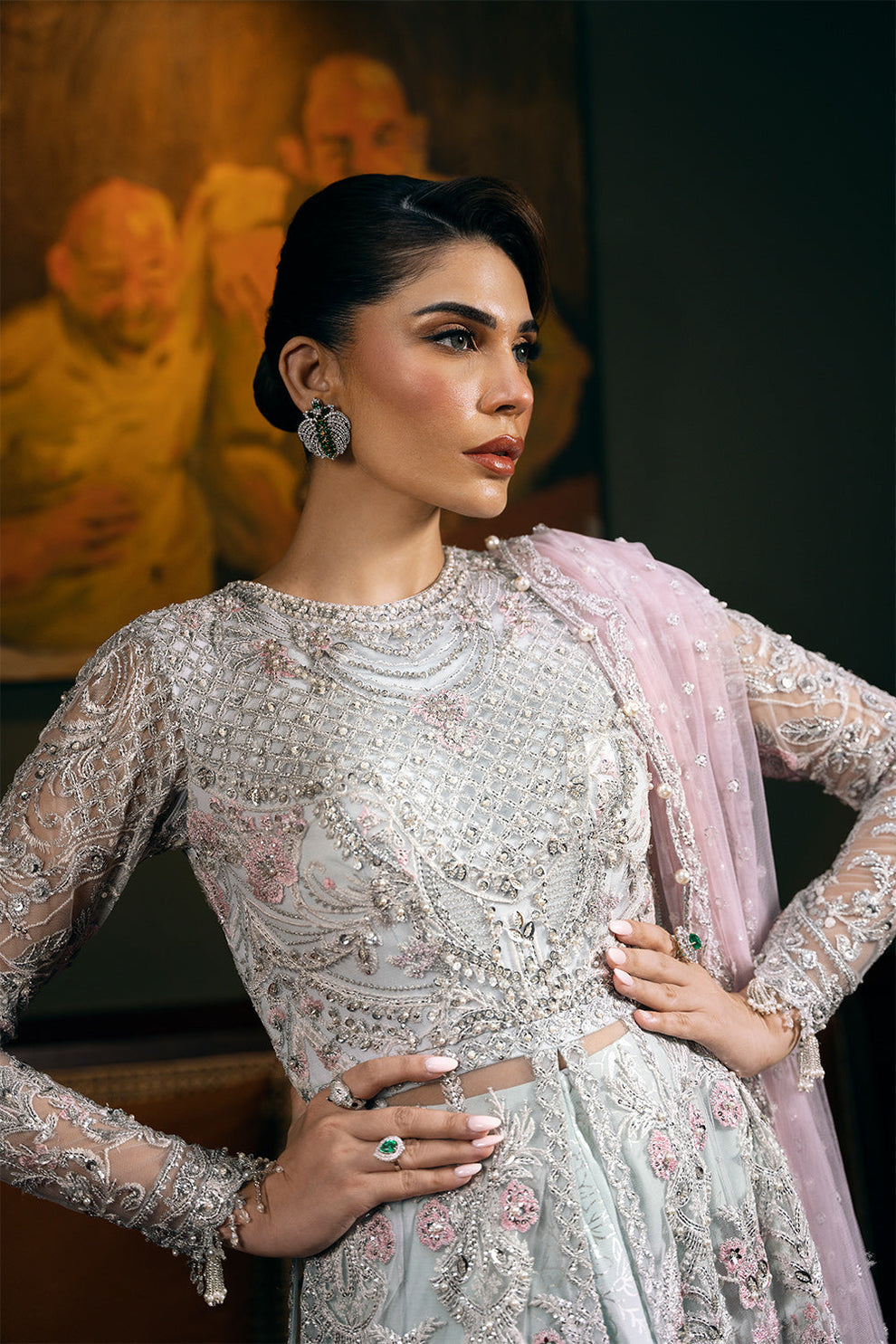 Saira Rizwan Kylo unstitched net ensemble featuring embroidered sequined and embellished front, back, sleeves, and panels, paired with an embroidered sequined net dupatta and raw silk lehenga with lining, perfect for weddings and formal occasions.