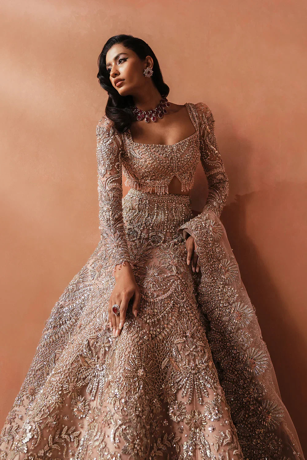 Soraya Catherine soft pink net bridal lehenga choli featuring intricate handwork with sparkling crystals, classic dabka embroidery, fine katdana detailing, and traditional mukesh work on a delicately embellished lehenga, paired with a matching net dupatta with coordinated detailing, perfect for wedding ceremonies, nikkah, and bridal receptions.