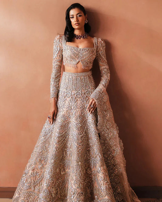 Soraya Catherine soft pink net bridal lehenga choli featuring intricate handwork with sparkling crystals, classic dabka embroidery, fine katdana detailing, and traditional mukesh work on a delicately embellished lehenga, paired with a matching net dupatta with coordinated detailing, perfect for wedding ceremonies, nikkah, and bridal receptions.