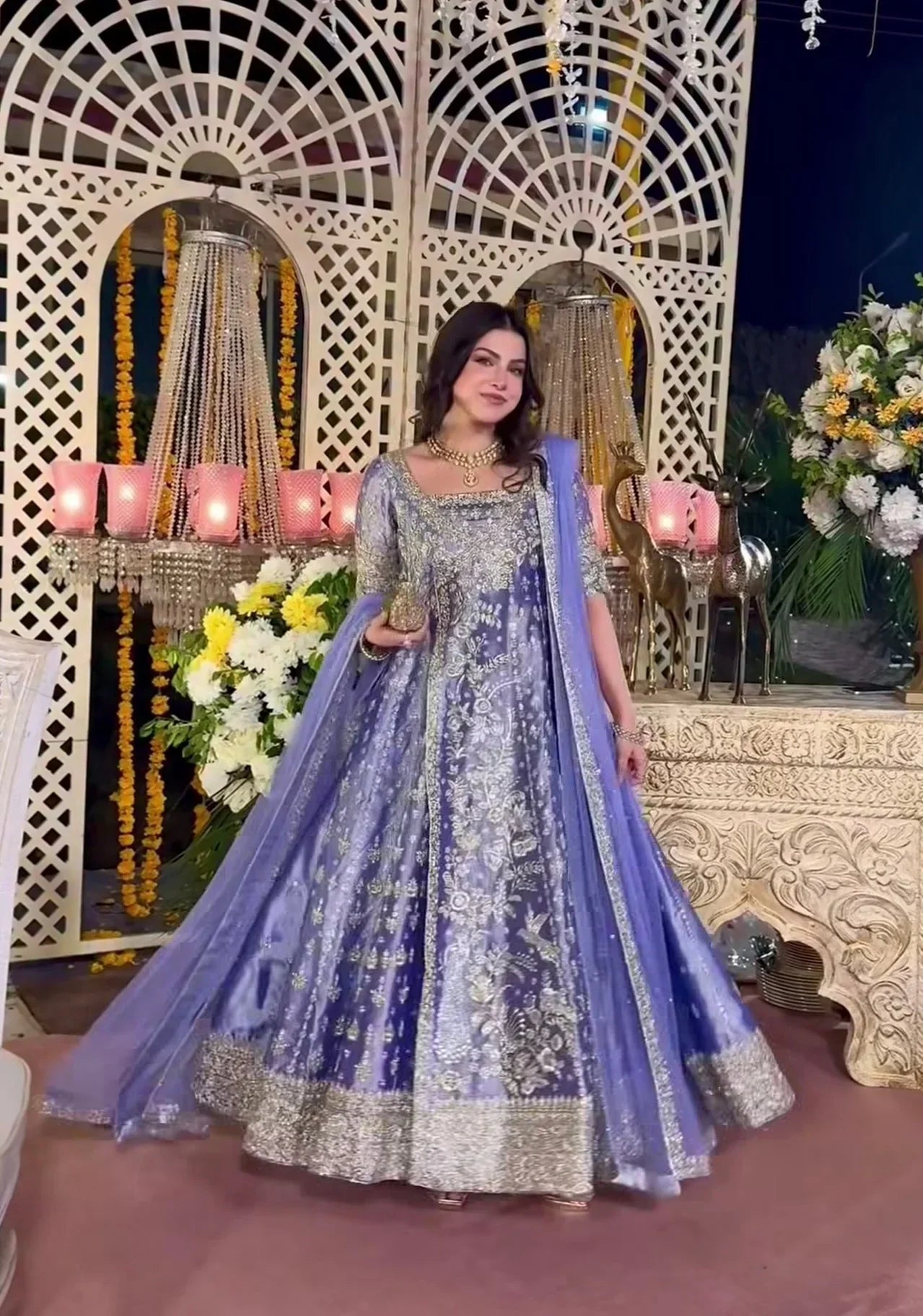 Haris Shakeel inspired Eyena ensemble in soft periwinkle-lilac featuring intricate silver zari, sequins, and resham embroidery delicately scattered across flowing panels with a richly embellished border, paired with a sheer net dupatta, perfect for festive occasions, mehndi functions, nikkah ceremonies, and formal gatherings.