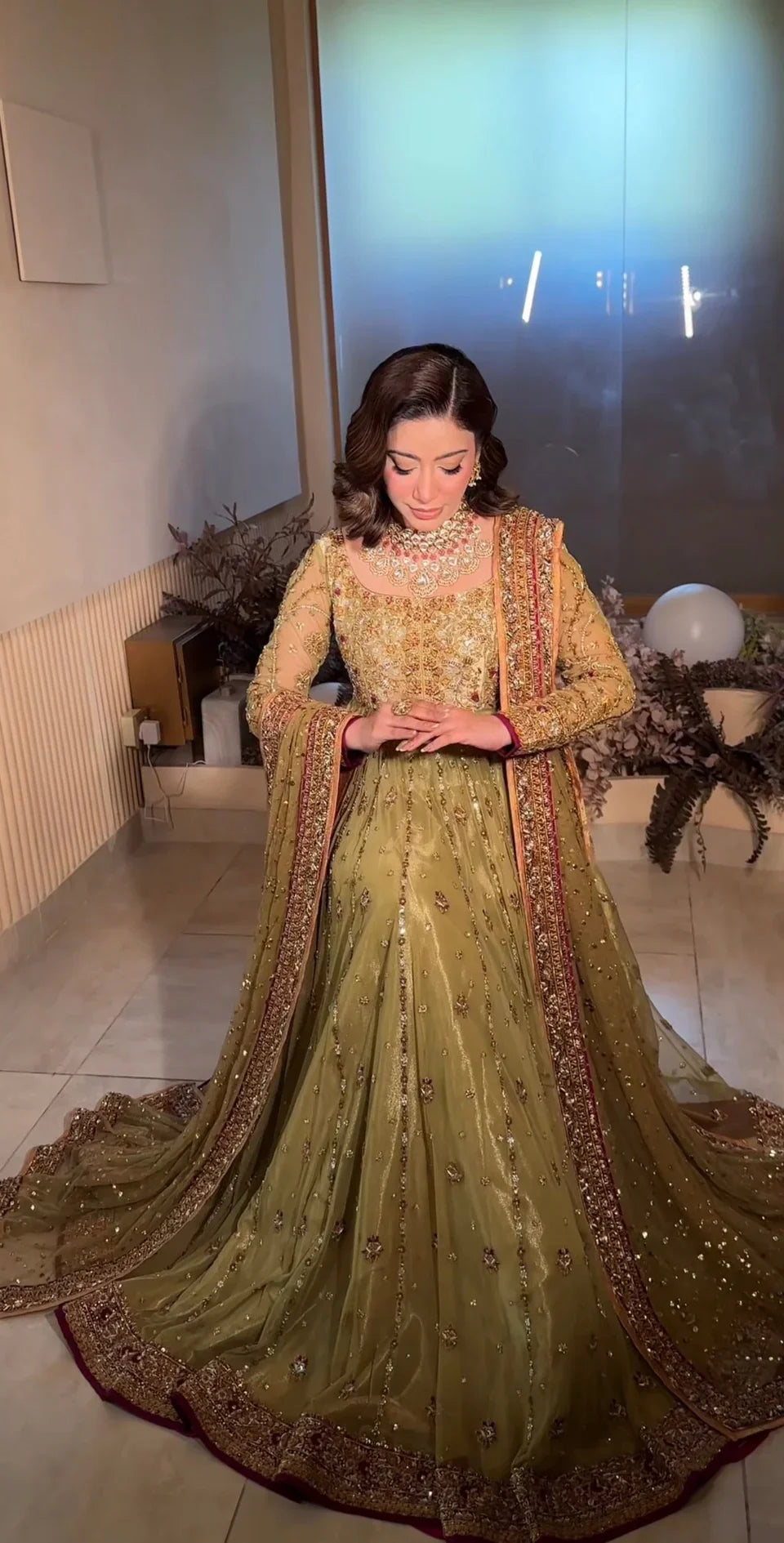 Haris Shakeel inspired pistachio green festive ensemble featuring a shirt with intricate embroidery and delicate embellishments creating a refined luminous texture, paired with a coordinated dupatta with rich contrasting borders and straight-cut trousers, perfect for wedding festivities, formal gatherings, and celebratory occasions.