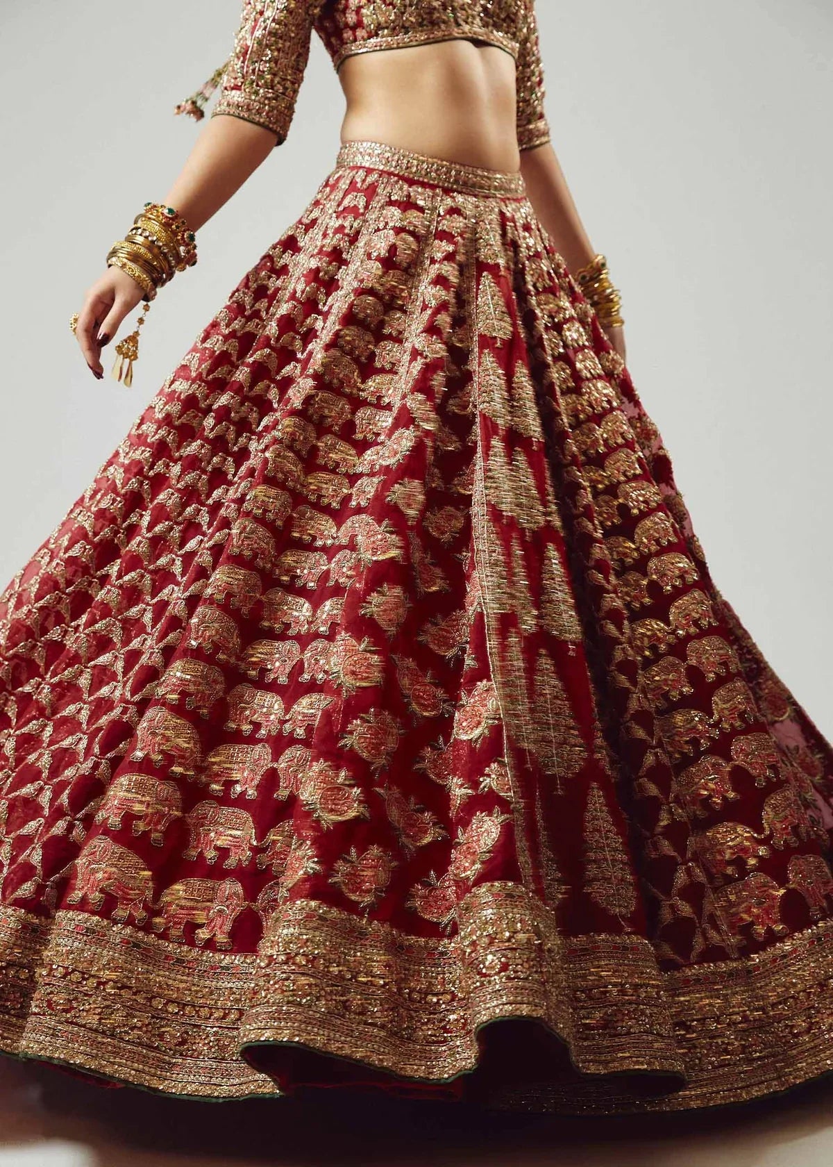 Hussain Rehar Raaqs red pure organza lehenga choli featuring intricate hand embellishments with rich dimensional finish, paired with a pure organza scallop cutwork dupatta that drapes gracefully with ethereal lightweight movement, perfect for bridal wear, weddings, receptions, and grand celebrations.