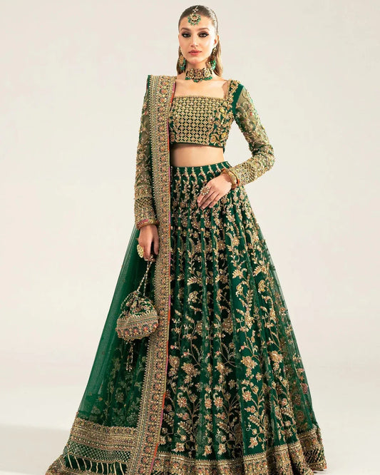  Kanwal Malik Sukhan bottle green net lehenga choli featuring an intricately embellished choli and flowing lehenga with a floral jaal design in vibrant orange and pink accents, enhanced with gold, gotta, and silver embellishments, complete with a matching net dupatta with an embellished border, perfect for weddings and festive occasions.