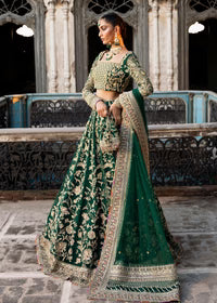  Kanwal Malik Sukhan bottle green net lehenga choli featuring an intricately embellished choli and flowing lehenga with a floral jaal design in vibrant orange and pink accents, enhanced with gold, gotta, and silver embellishments, complete with a matching net dupatta with an embellished border, perfect for weddings and festive occasions.