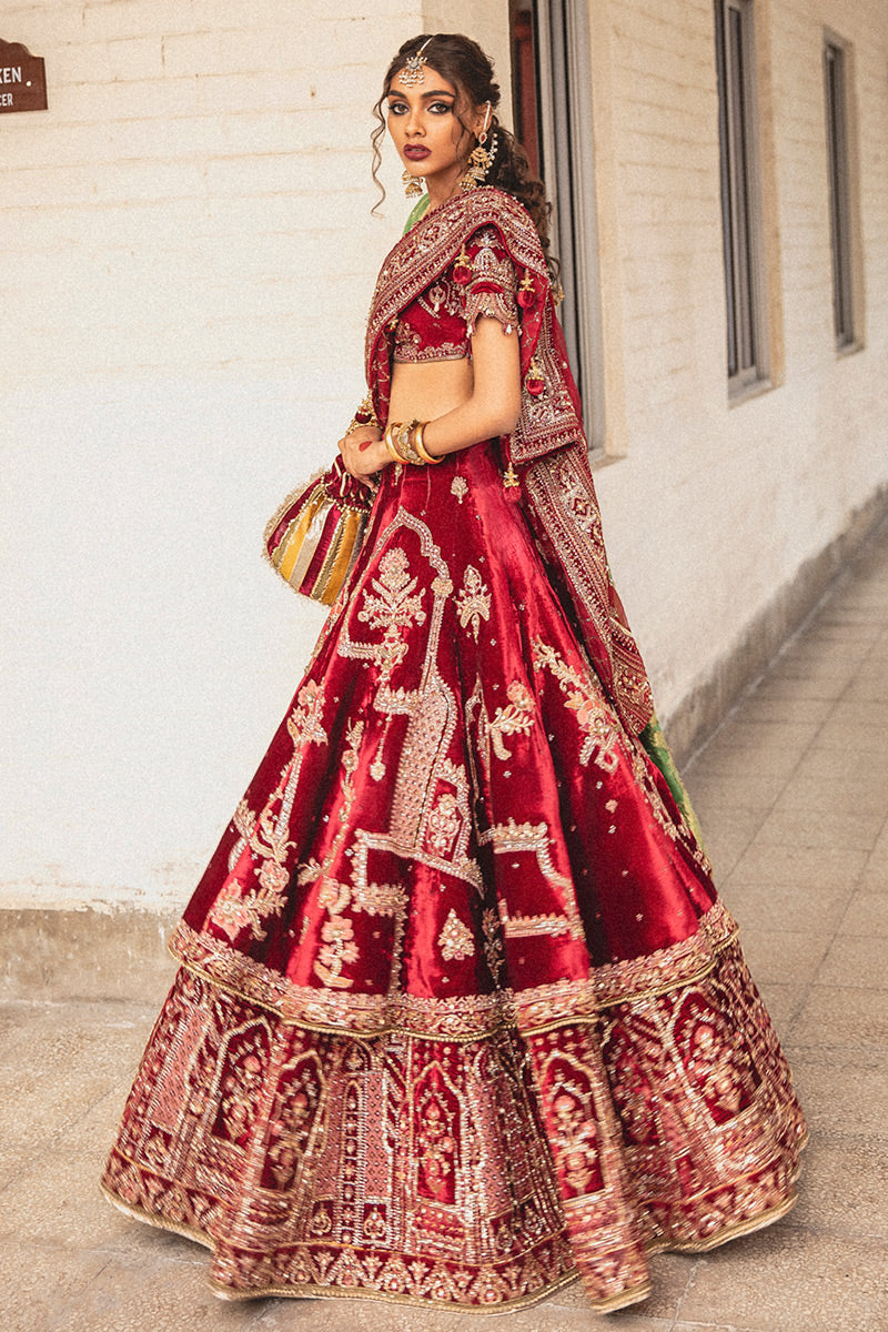 Mohsin Naveed Ranjha MNR HR-71 sindoori red raw silk bridal ensemble featuring a half-sleeved boat neck choli with hand-embellished motifs, worn with a two-tiered lehnga doused in signature Mughal miniature patterns, complete with a chan booti dupatta and a hand-loomed cotton net jamawar shawl, Pakistani luxury wedding formal wear.