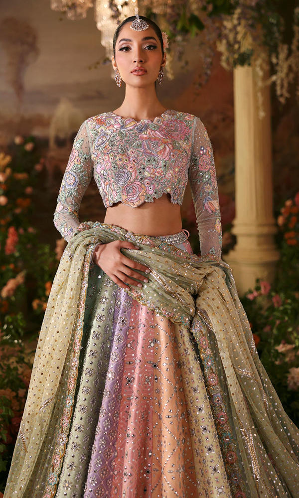 Nomi Ansari Fairytale pastel bridal lehenga choli featuring a harmonious blend of blush pink, powder blue, and pistachio tones with intricate hand embroidery, delicate zari work, and shimmering embellishments on a beautifully panelled lehenga with a finely embellished choli and a dreamy net dupatta with subtle detailing, perfect for valima, engagement, nikah, and reception events.